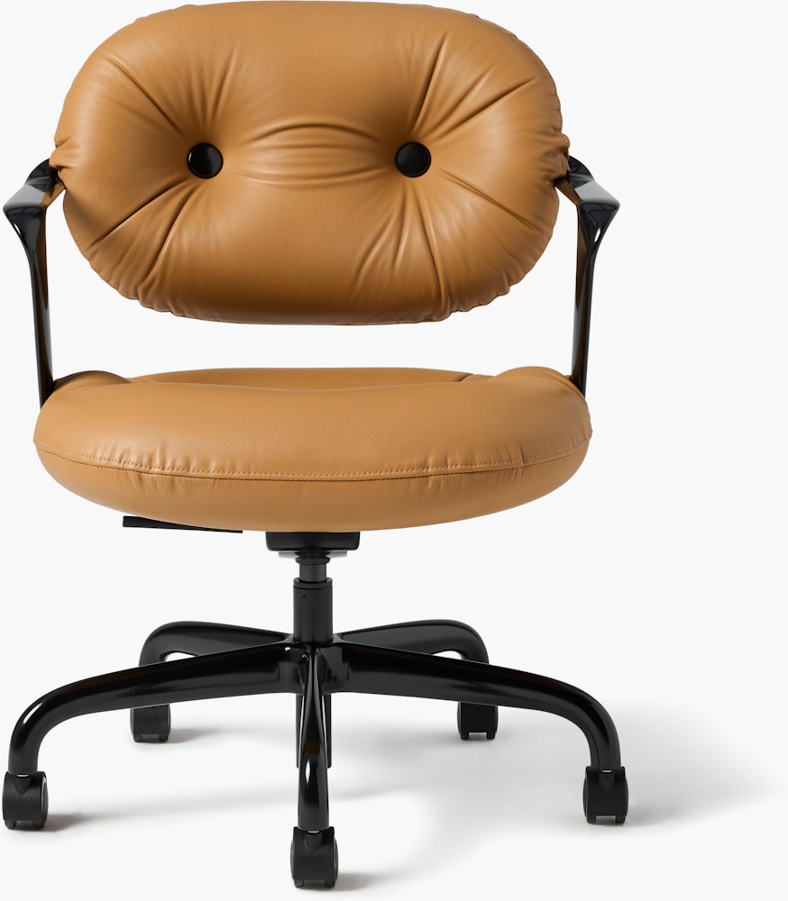 Front view of a Morrison Hannah chair with a black frame and base with fixed arms and light brown leather upholstery.