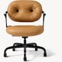Front view of a Morrison Hannah chair with a black frame and base with fixed arms and light brown leather upholstery.