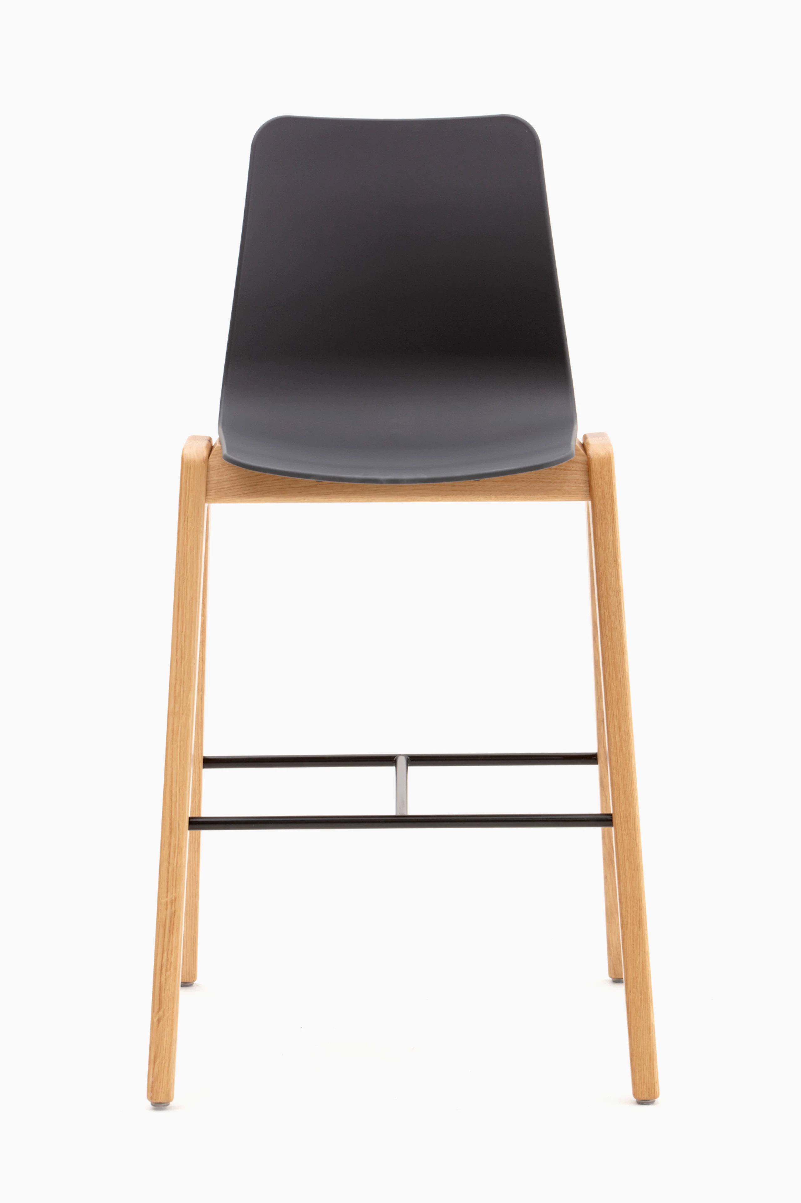 A black naughtone Polly Wood Stool with an oak base, viewed from the front.