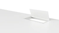 An open, white, desktop pop-up power port.