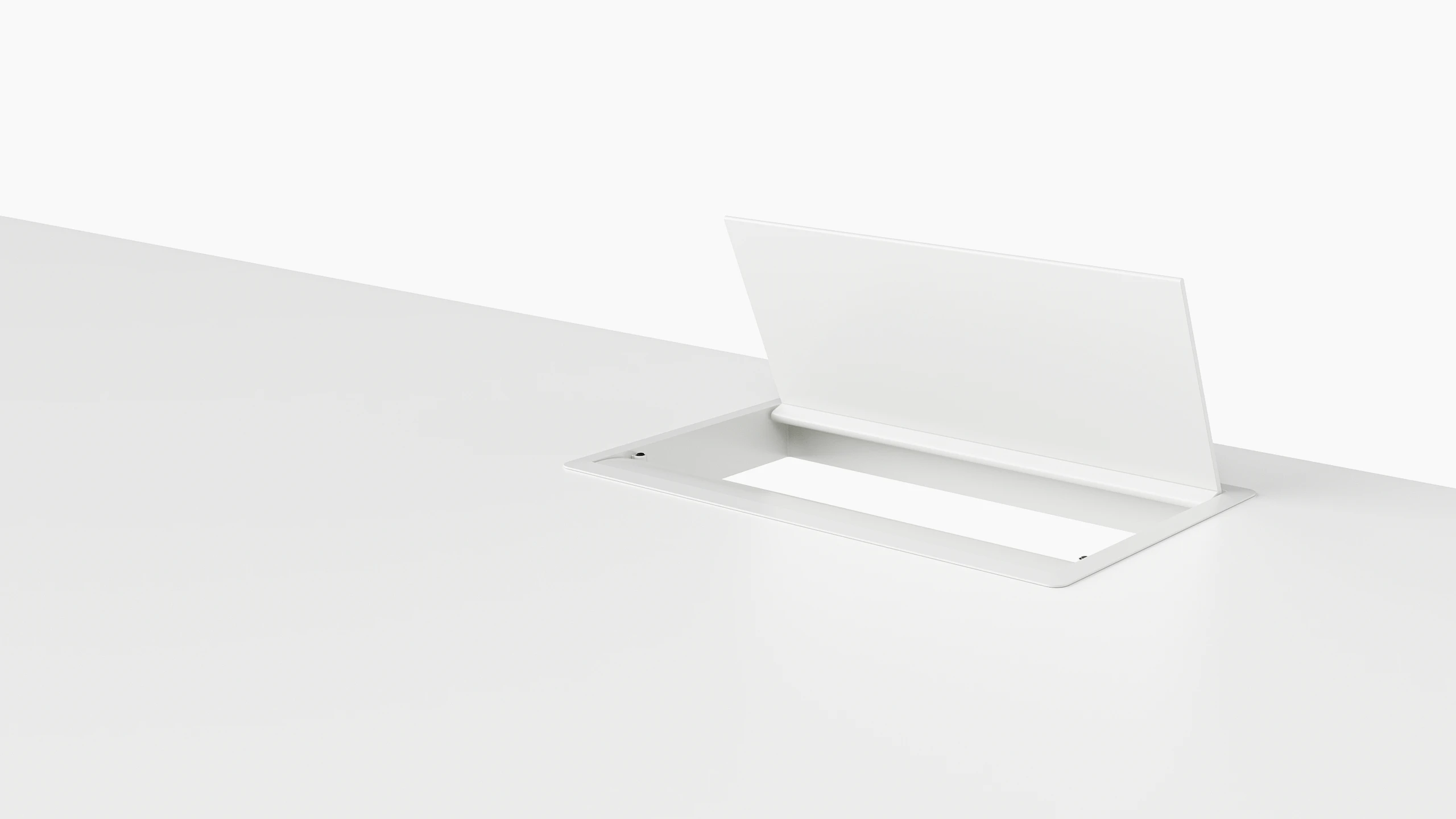 An open, white, desktop pop-up power port.