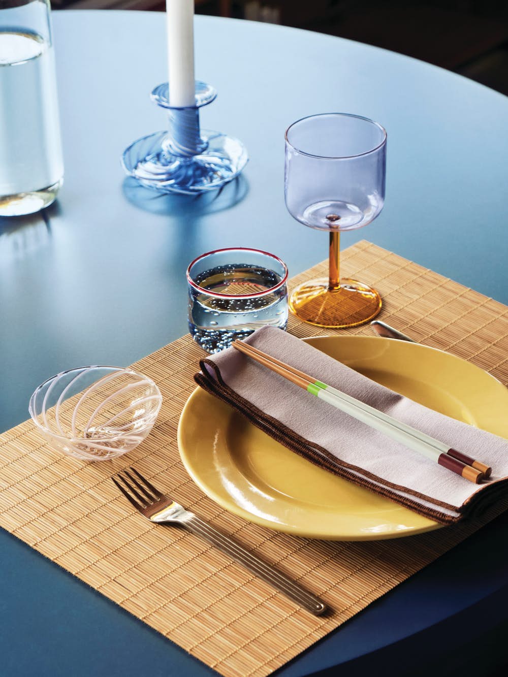 Rainbow Plate, Tint Glasses, Tint Wine Glasses, Color Sticks, and Bamboo Placemat on a dining table
