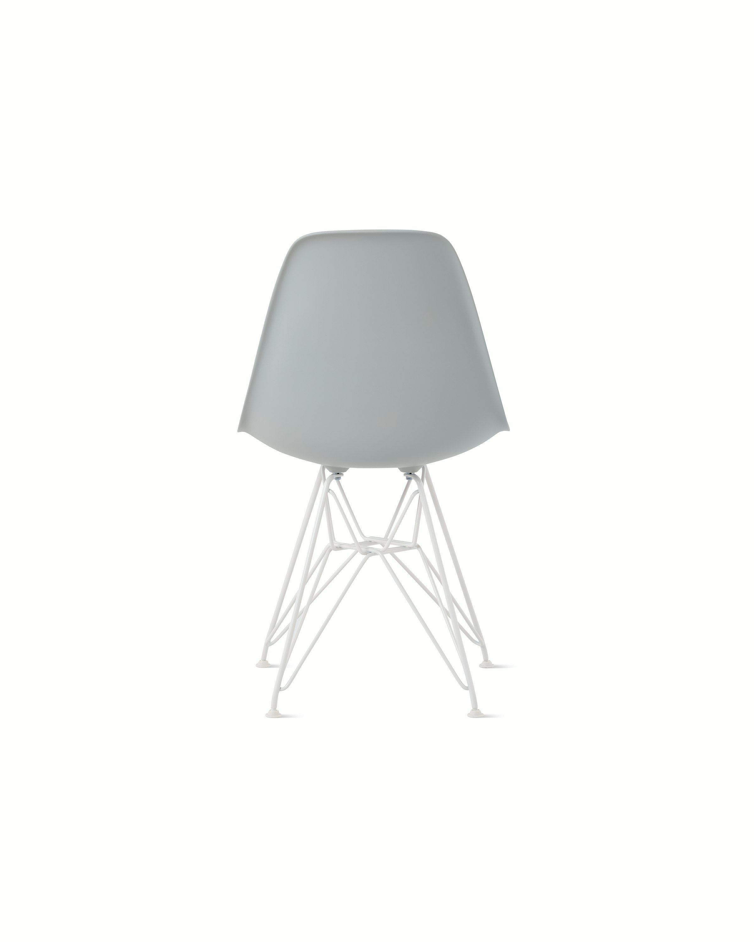 Back of light grey plastic shell chair on wire base.