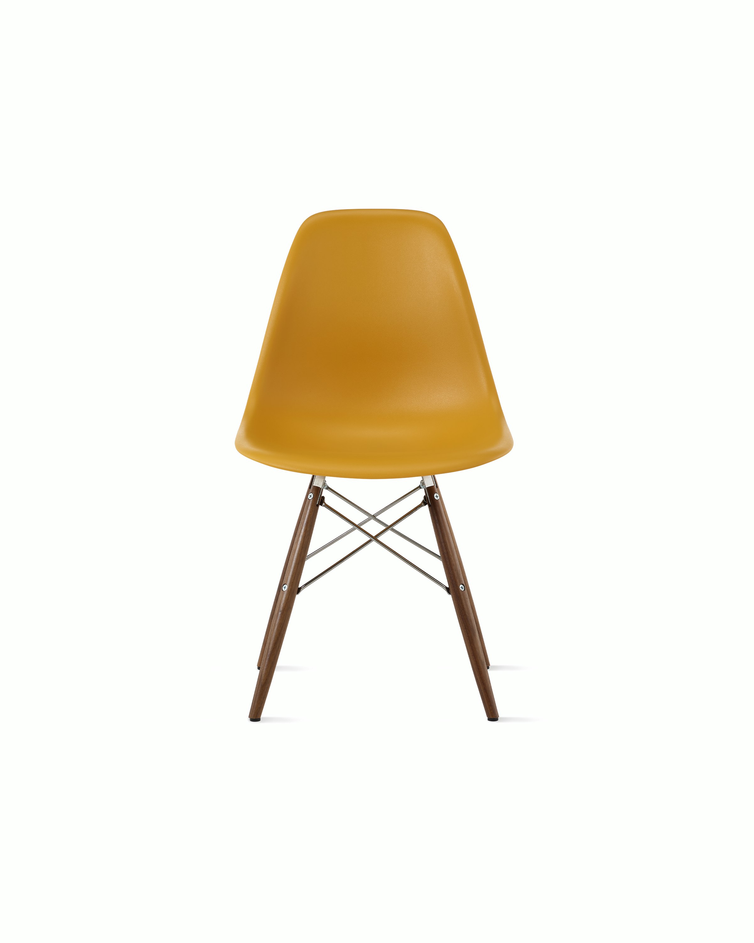 Front of deep yellow plastic shell chair on dowel-base legs.
