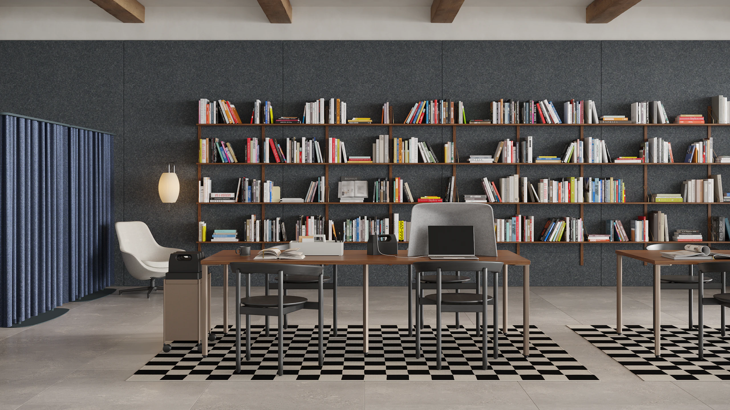 Study Hall with brown OE1 Project Tables, OE1 Storage Trolley, OE1 Workbox and OE1 Personal Hoodie with black Comma Chairs, and bookshelves in the background.