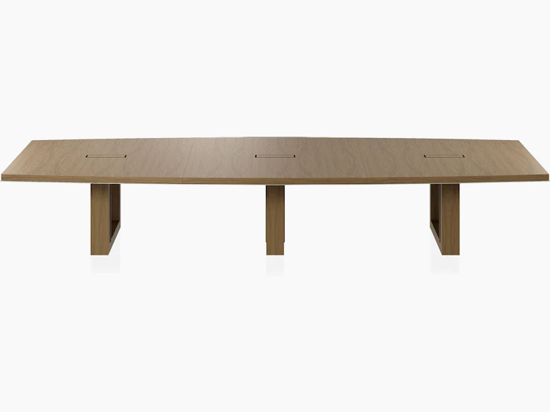 Boat-shaped Highline Fifty Conference Table in Natural Flat Cut Walnut with a Satin Nickel edge viewed from the front.
