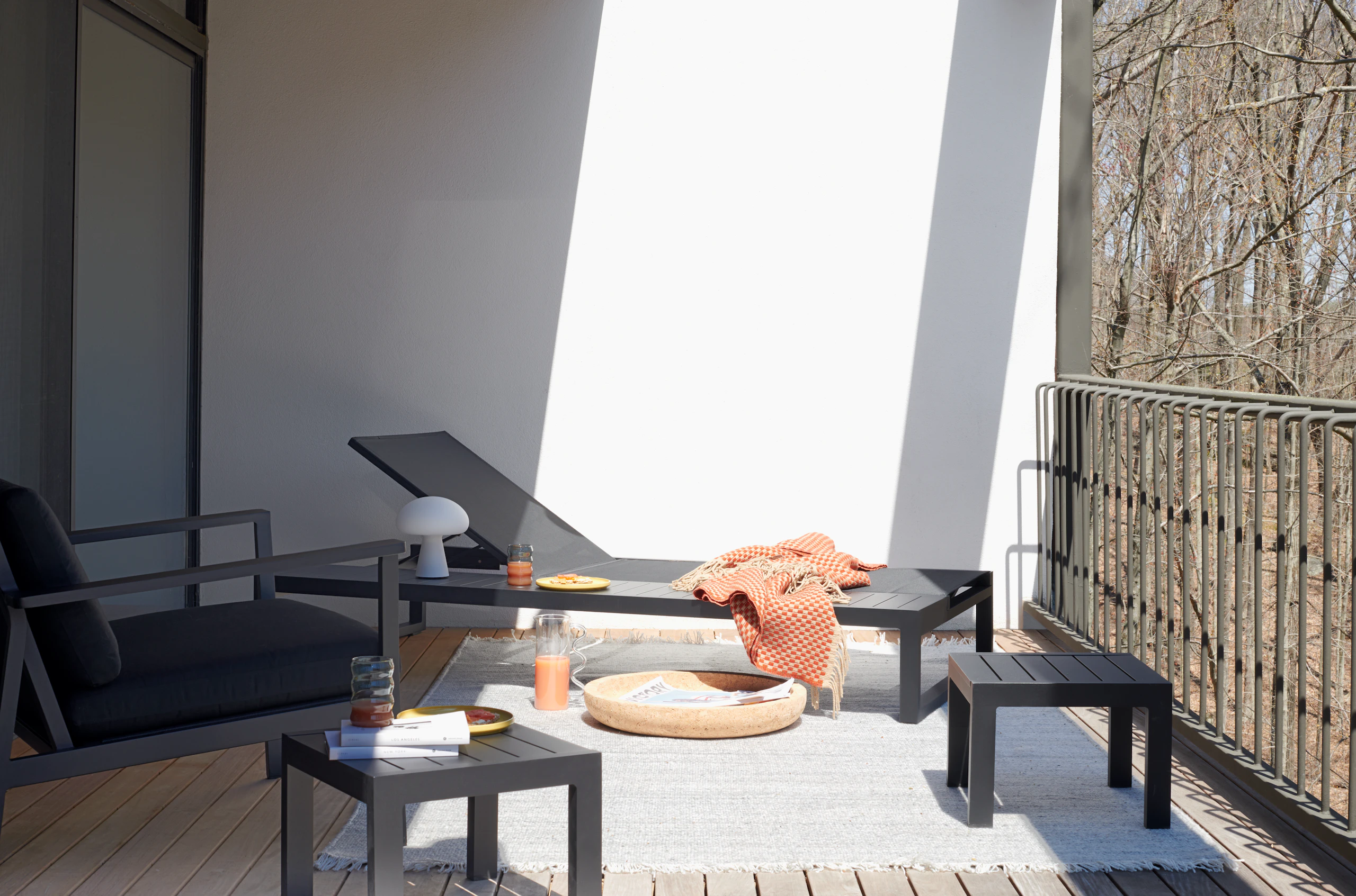 EOS Platform Lounger, EOS Side Table, Isak Throw, Vitra Cork Bowls, Wave Pitcher, Indra Indoor-Outdoor Rug, Obello Portable Lamp