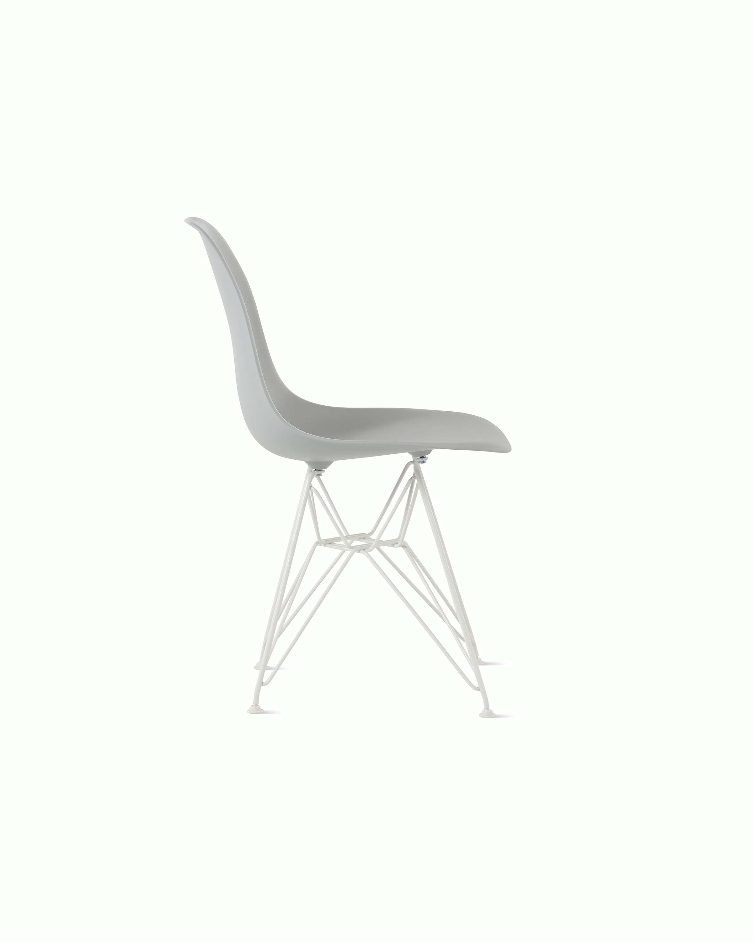 Side of light grey plastic shell chair on wire base.