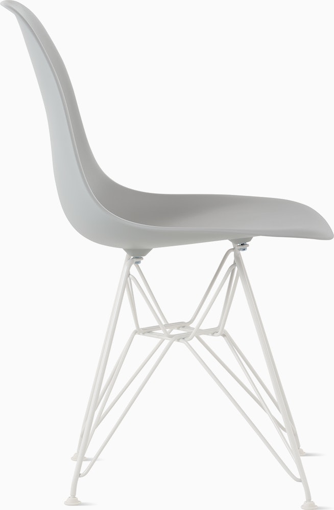 Side of light grey plastic shell chair on wire base.