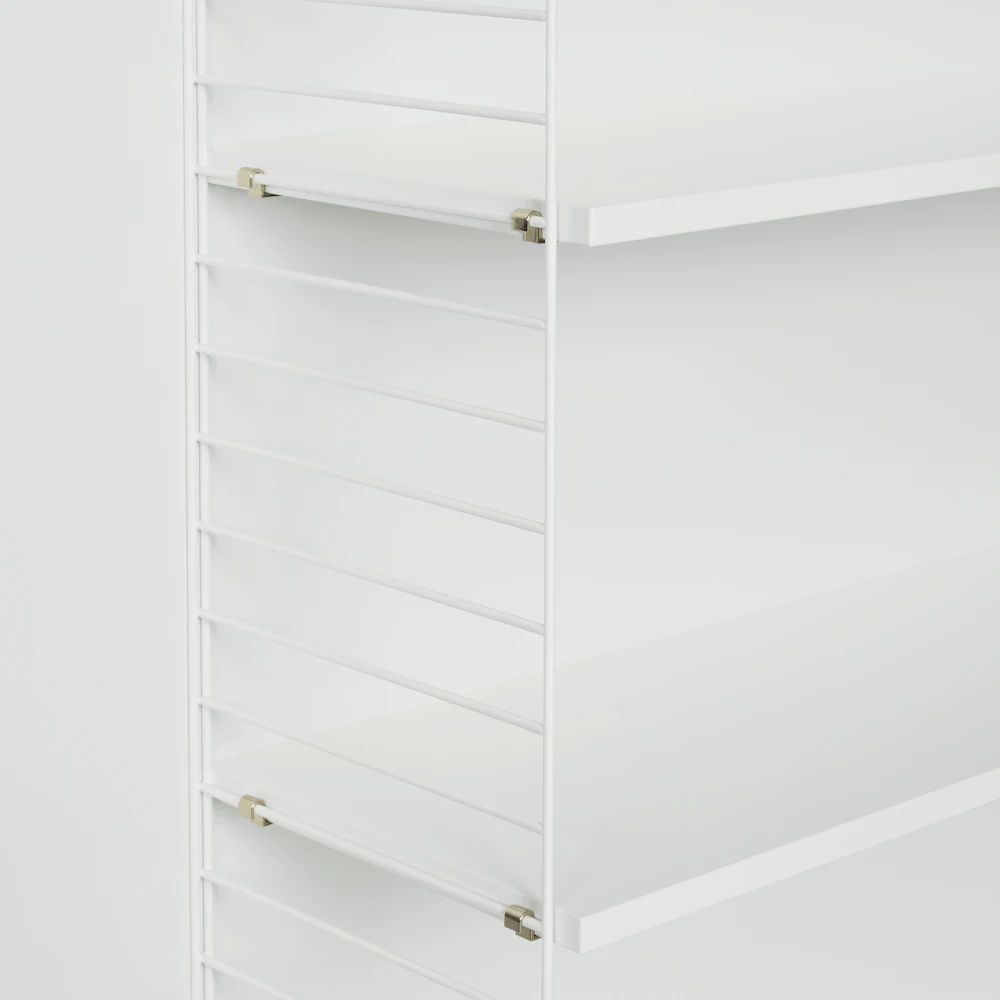 Close-up of white metal shelving unit frame and shelf