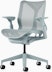A glacier low-back Cosm Chair with height adjustable arms.