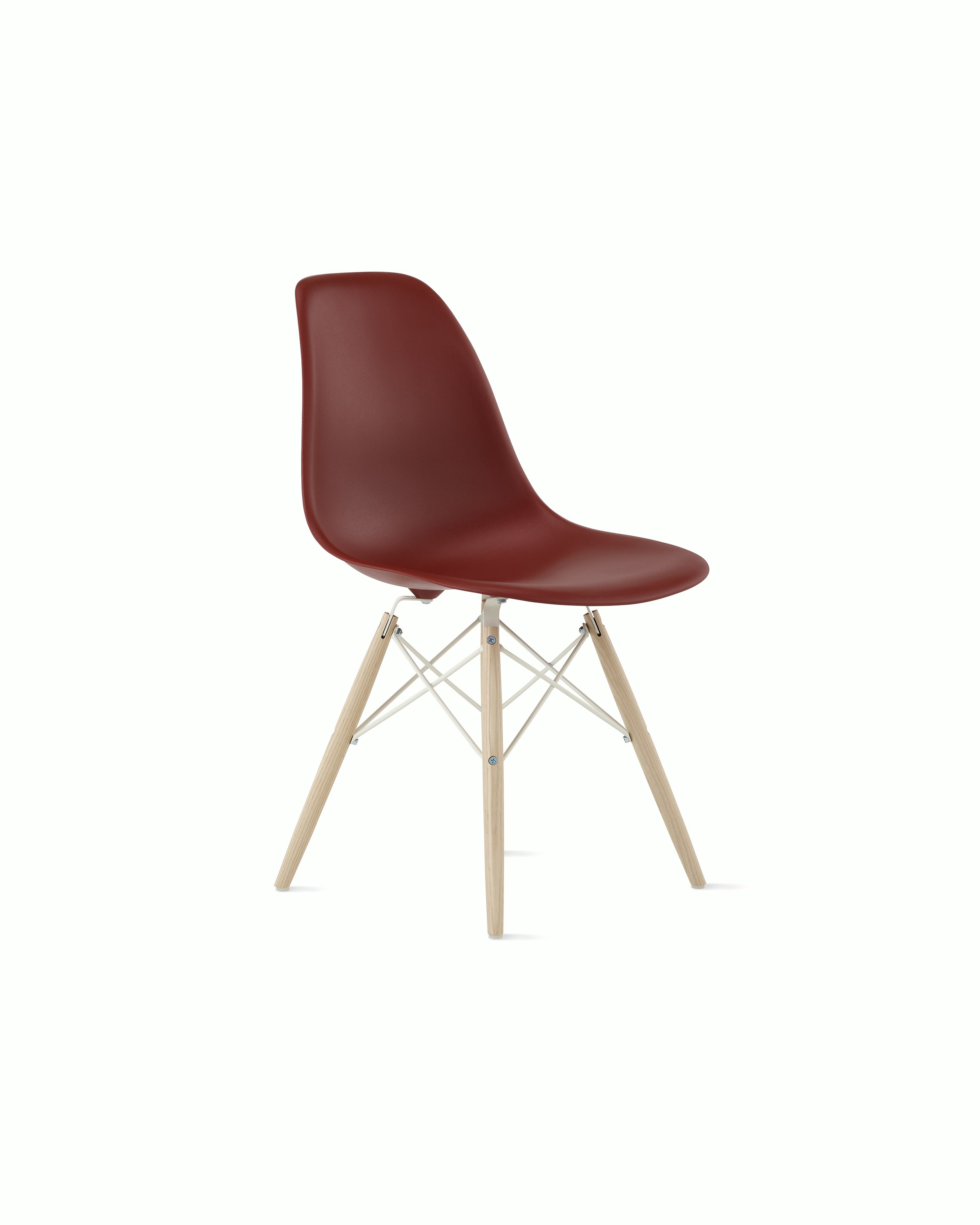 Front angle of brick red plastic shell chair with dowel base.
