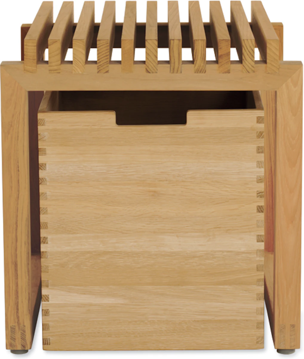 Top-down view of a wooden storage crate with finger joints and cutout handle.