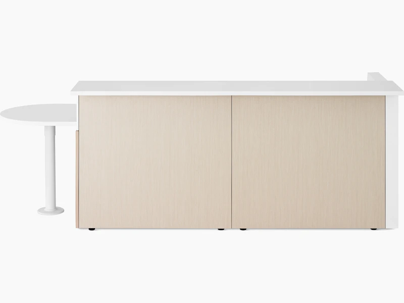 Ethospace Nurses Station in a light wood finish with transaction surface and ADA peninsula surface in white.
