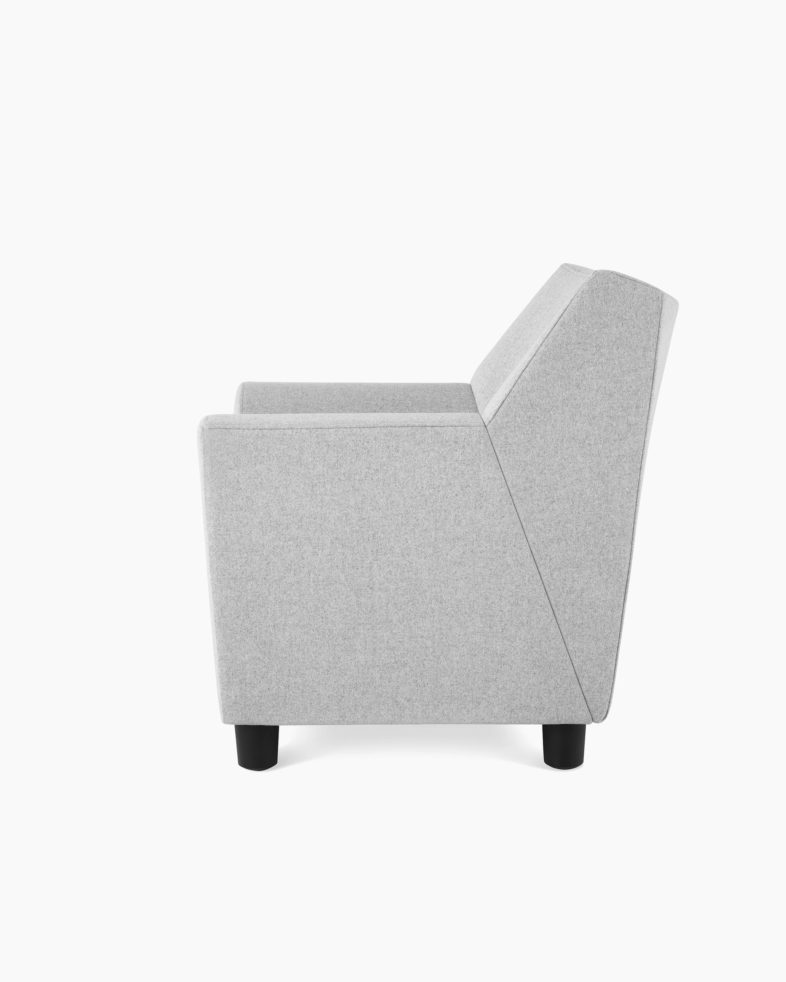 A Swoop Club Chair in light grey upholstery, viewed from the side.