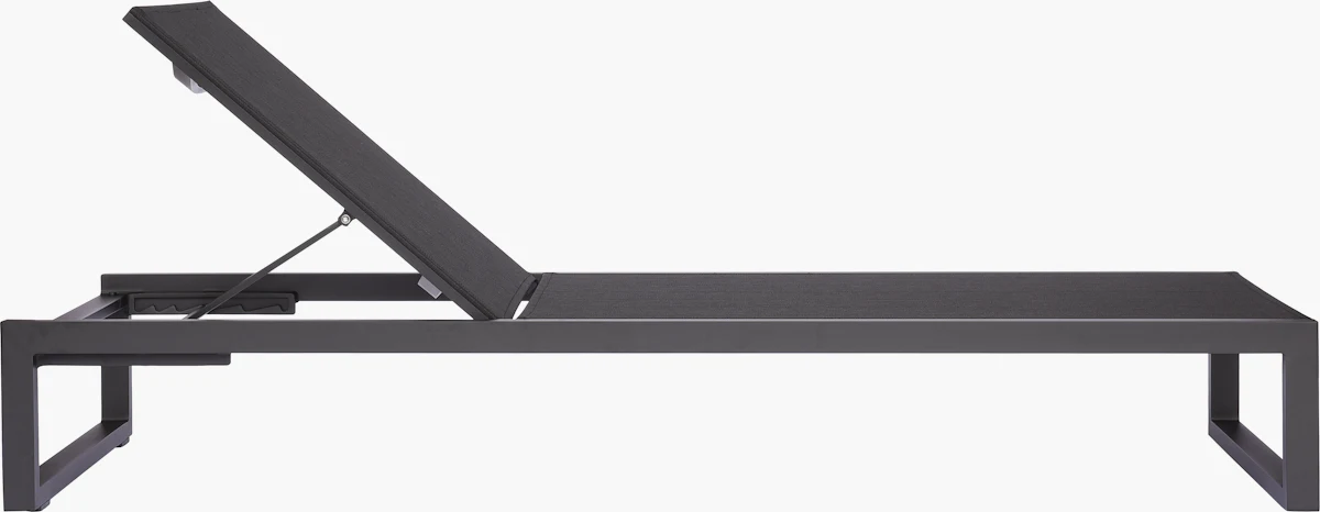 Close-up of black metal frame of outdoor chaise lounge chair