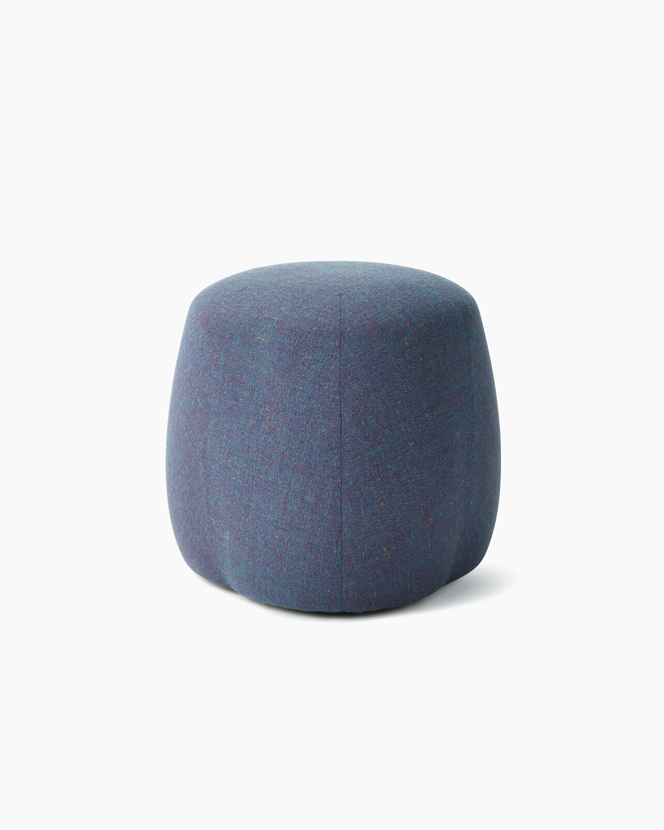 White background shot of a Truffle Pouf, Size B, fully upholstered in blue fabric.