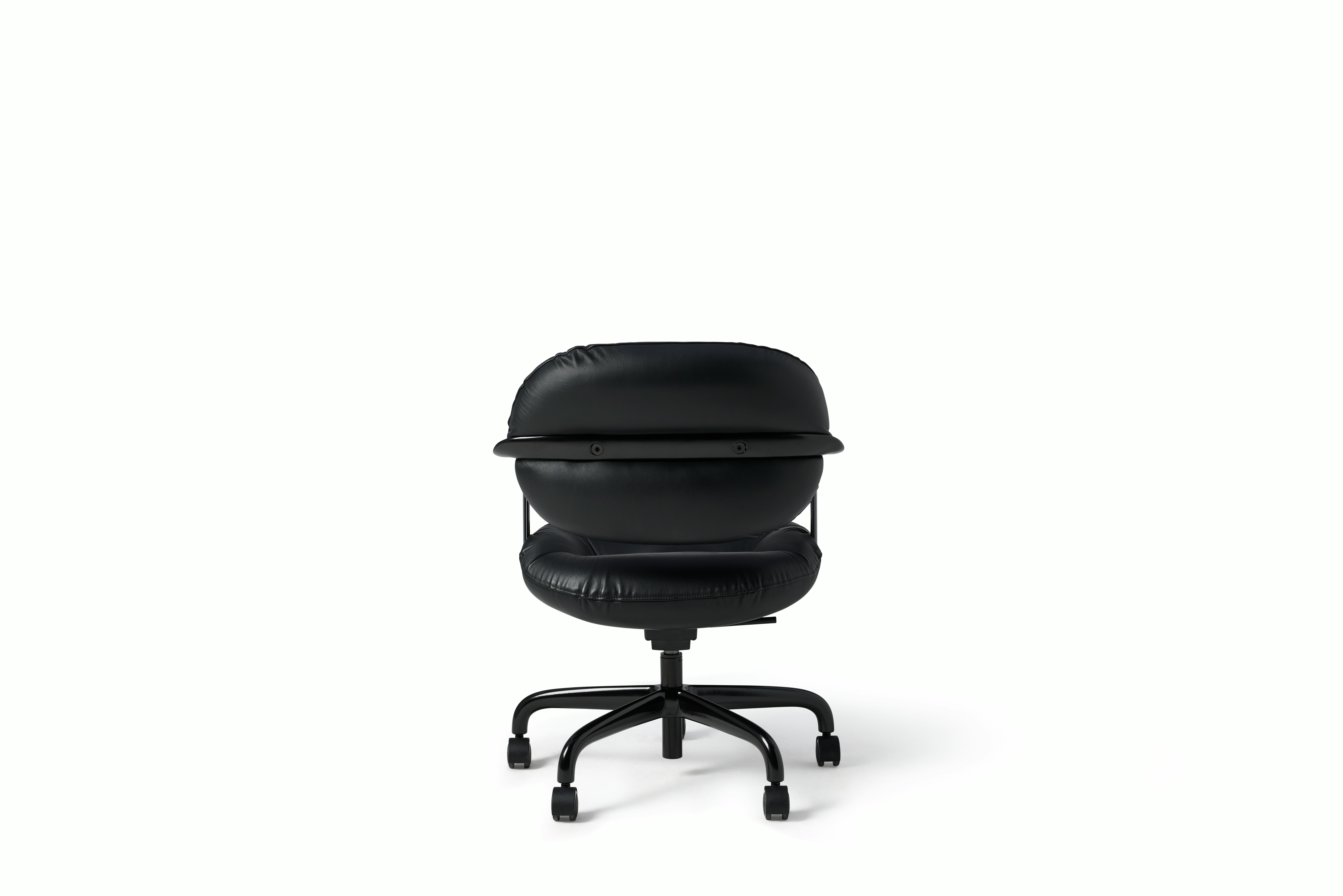 Rear view of a Morrison Hannah chair with a black frame and base with fixed arms and black leather upholstery.
