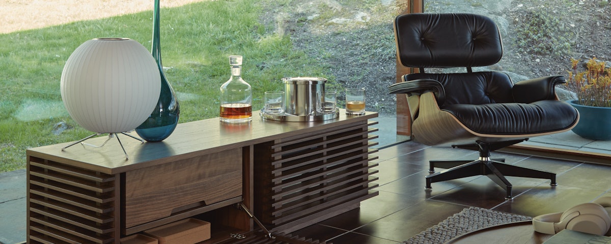 Line Media Console and Eames Lounge Chair and Ottoman in modern living room setting