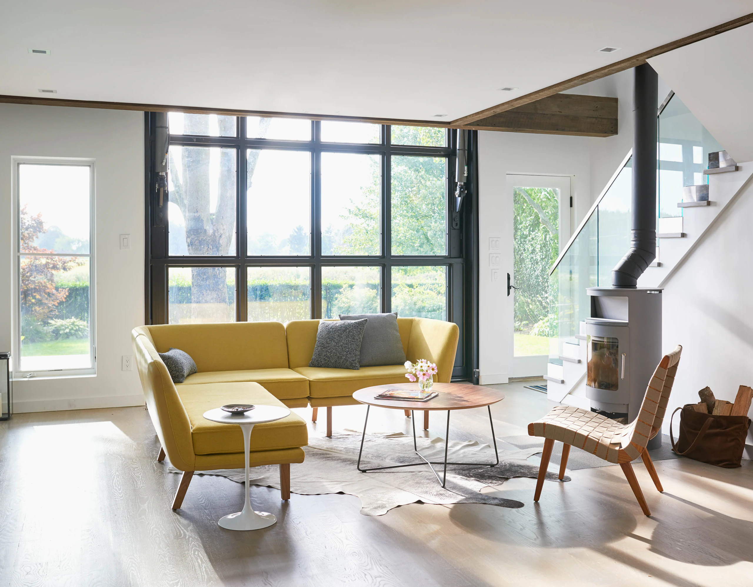 Rockwell Unscripted Modular Lounge with KnollStudio Risom Lounge Chair Saarinen Side Table Rockwell Unscripted Occasional table