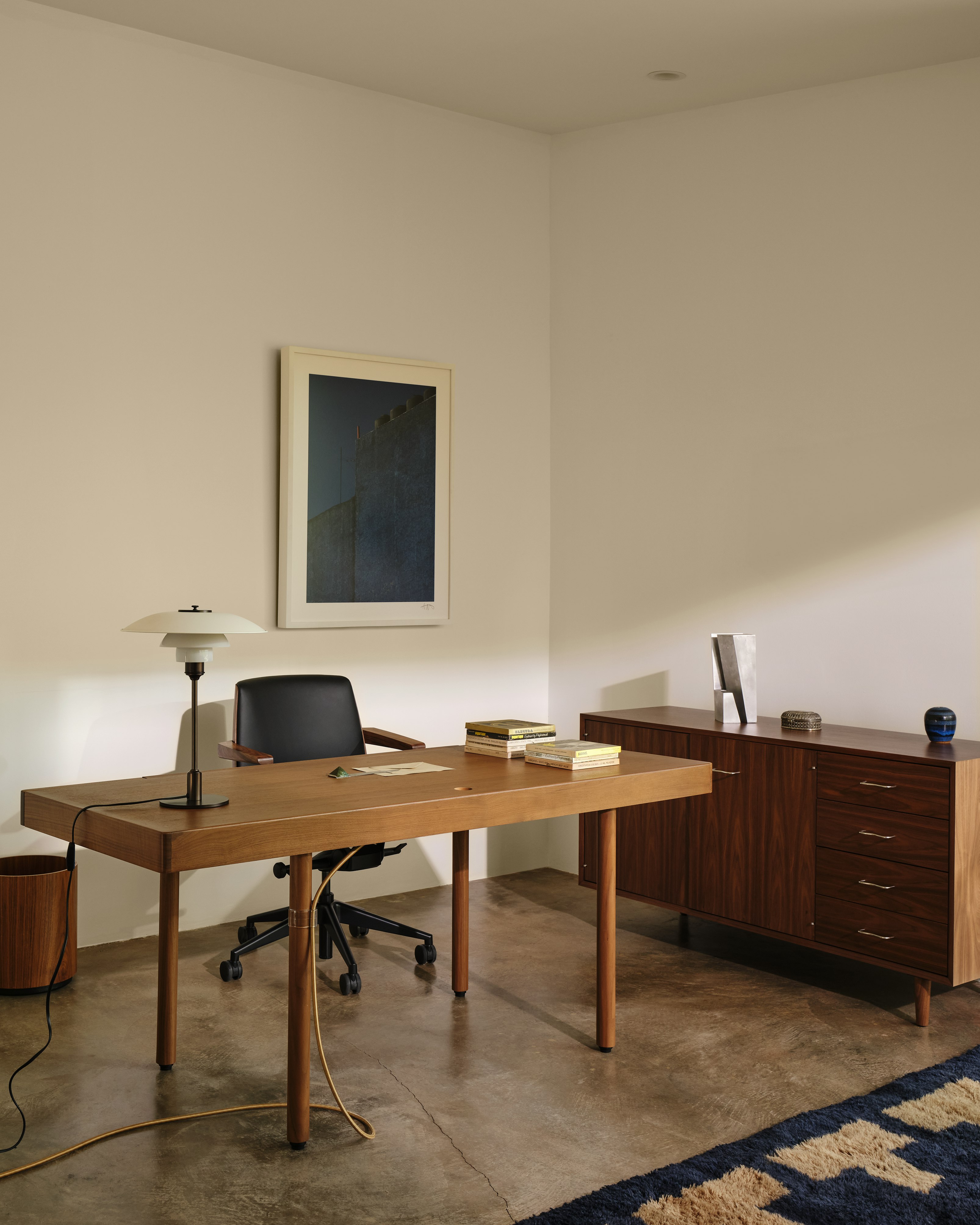 Nelson Basic Cabinet Series Credenza, Leatherwrap Veneer Desk, and Clamshell Chair in a home office setting