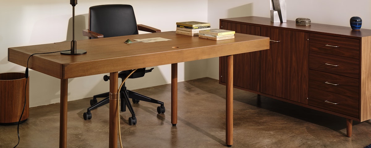 Nelson Basic Cabinet Series Credenza, Leatherwrap Veneer Desk, and Clamshell Chair in a home office setting