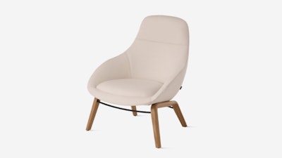 White background shot of Always Lounge Chair with cream fabric and wooden legs.
