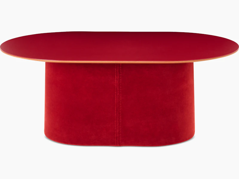 White sweep shot of Tun Coffee Table with deep red upholstered base and red Forbo table top.