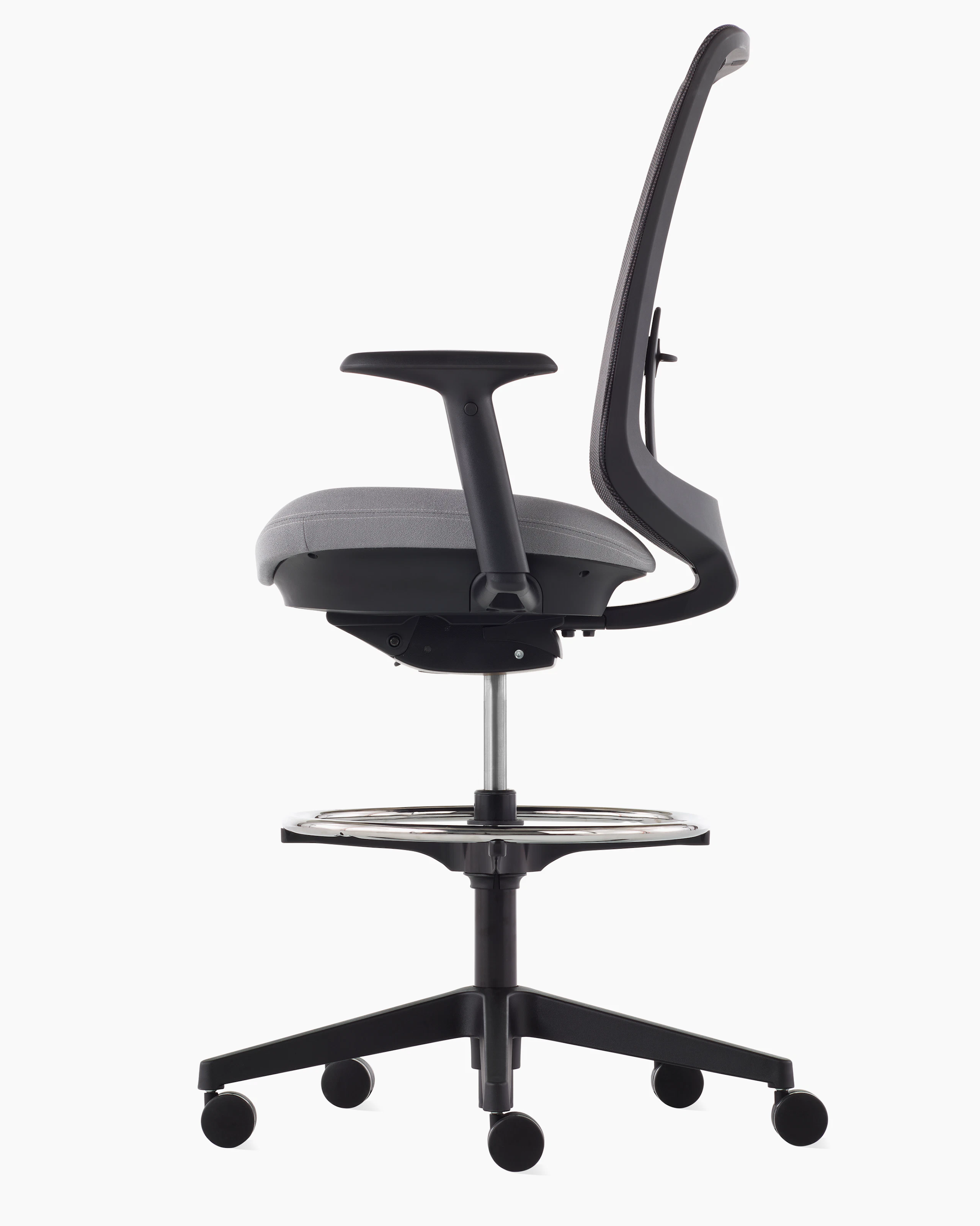 A black Verus Stool with a suspension back, grey seat and black frame viewed from the side.