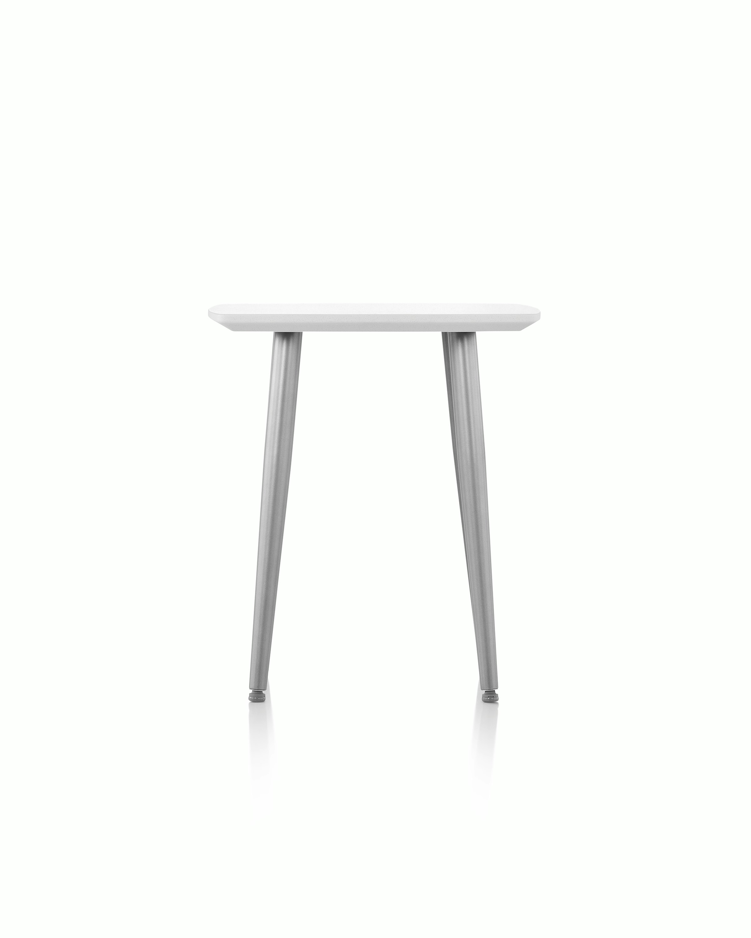 Palisade Occasional Table with metal legs and solid surface top on white sweep.