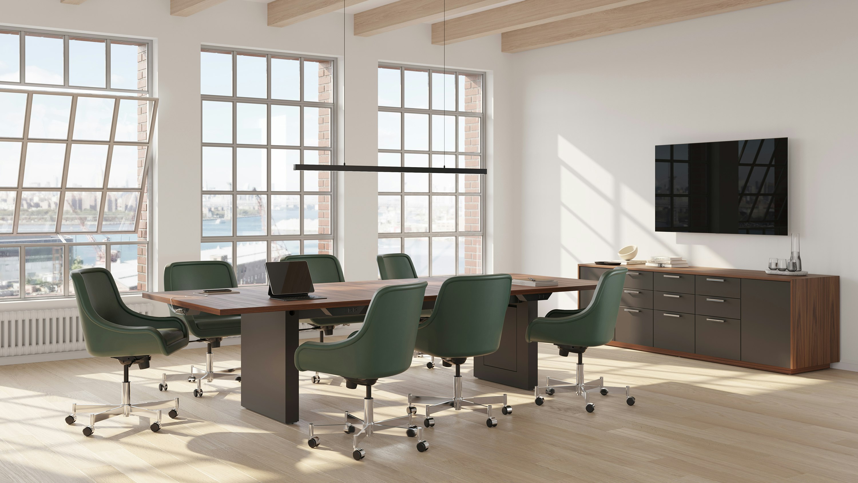 JD Conference Table and JD Credenza in Natural Walnut with Low Arm Bumper Chairs in Conference Room.