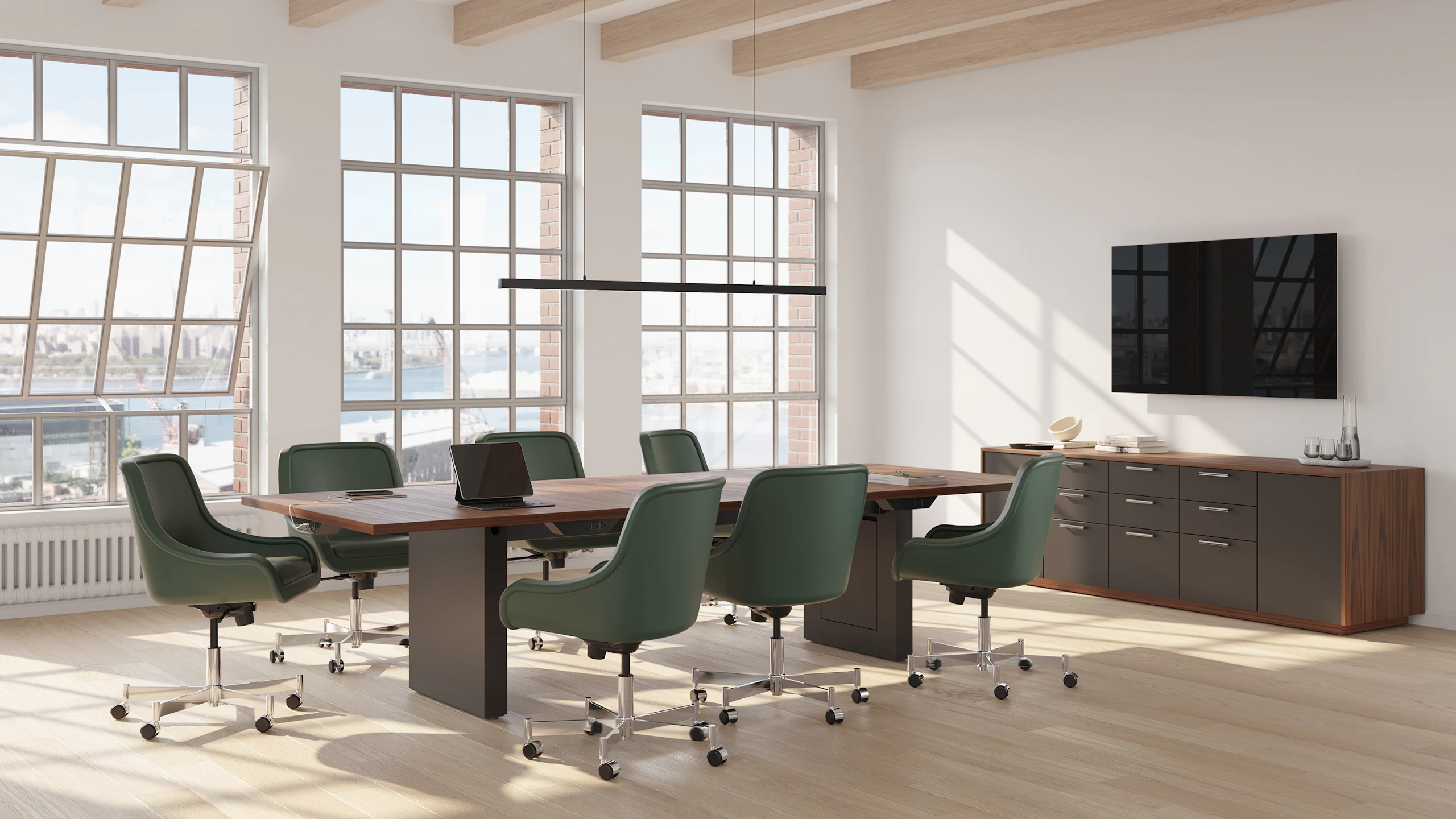 JD Conference Table and JD Credenza in Natural Walnut with Low Arm Bumper Chairs in Conference Room.