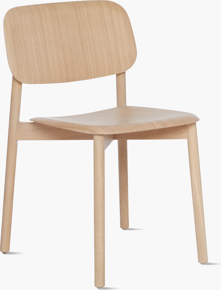 A matte lacquered oak Soft Edge 12 Side Chair viewed from an angle