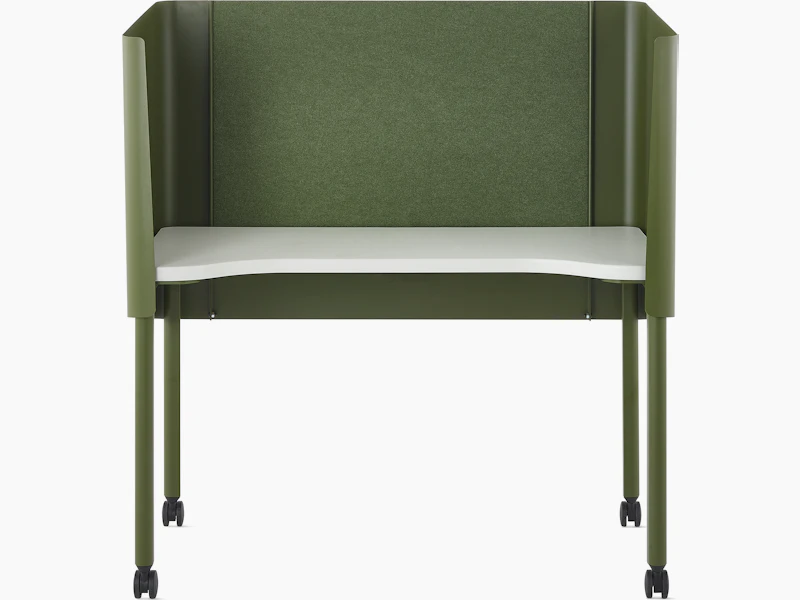 Green OE1 Nook with white surface and casters, viewed from the front.