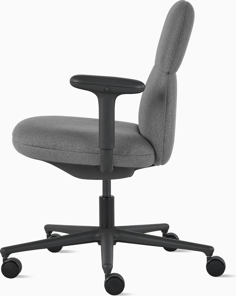 Side view of a mid-back Asari chair by Herman Miller in dark grey with height adjustable arms.