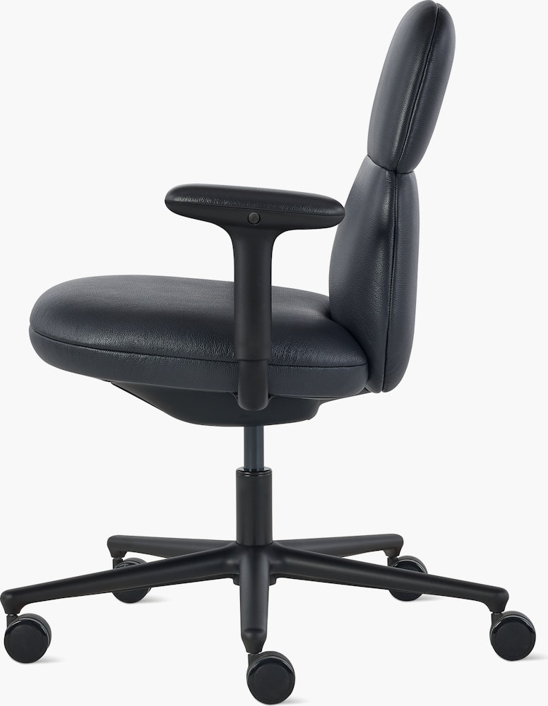Side view of a mid-back Asari chair by Herman Miller in black leather with height adjustable arms.