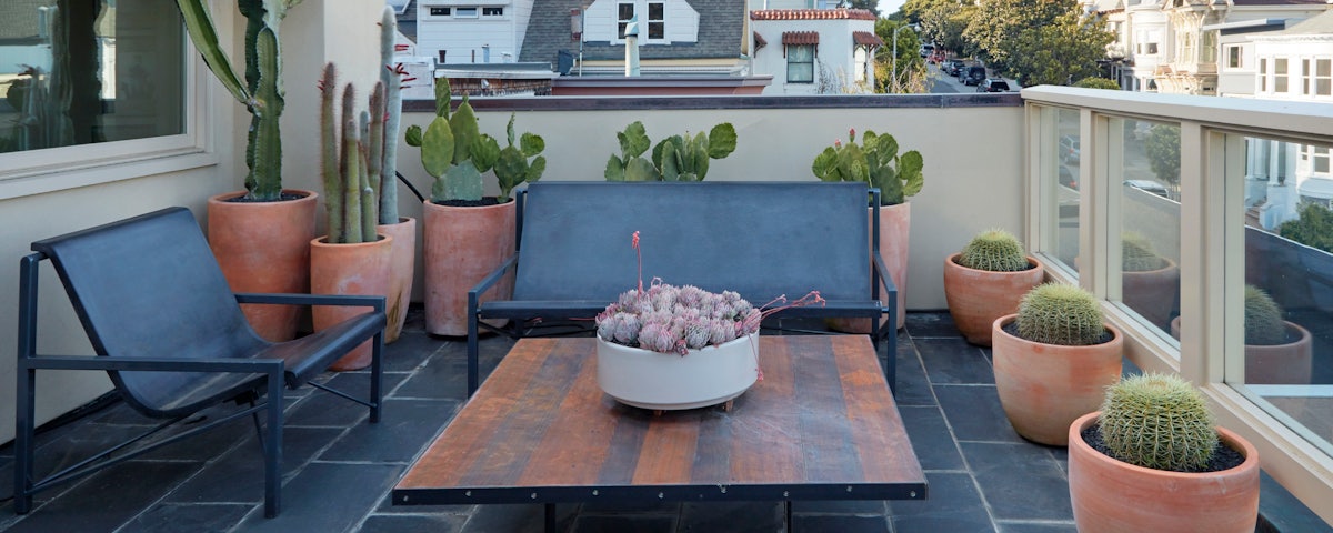 Evia Lounge Bench and Evia Lounge Chair in an outdoor patio setting