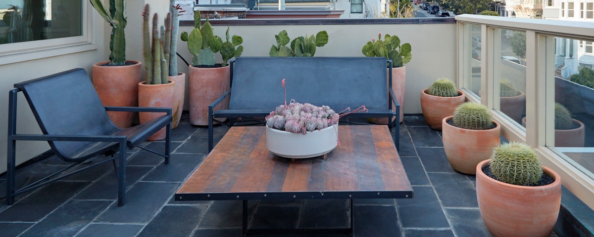 Evia Lounge Bench and Evia Lounge Chair in an outdoor patio setting