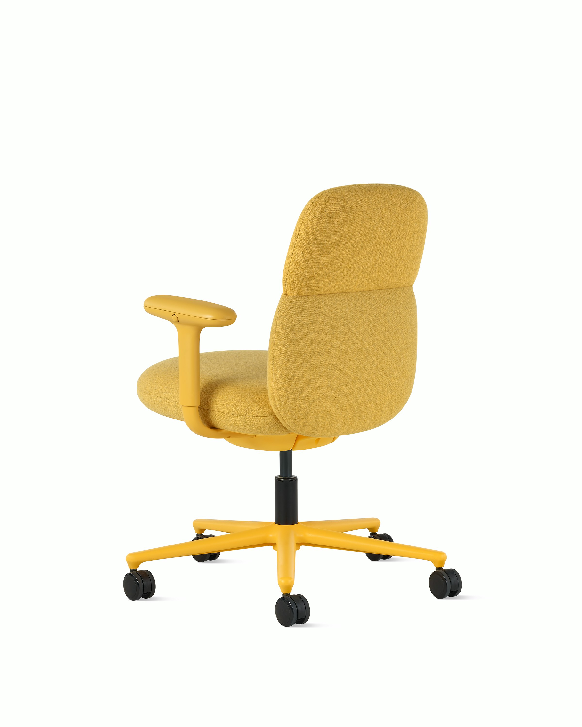 Rear angle view of a mid-back Asari chair by Herman Miller in yellow with height adjustable arms.