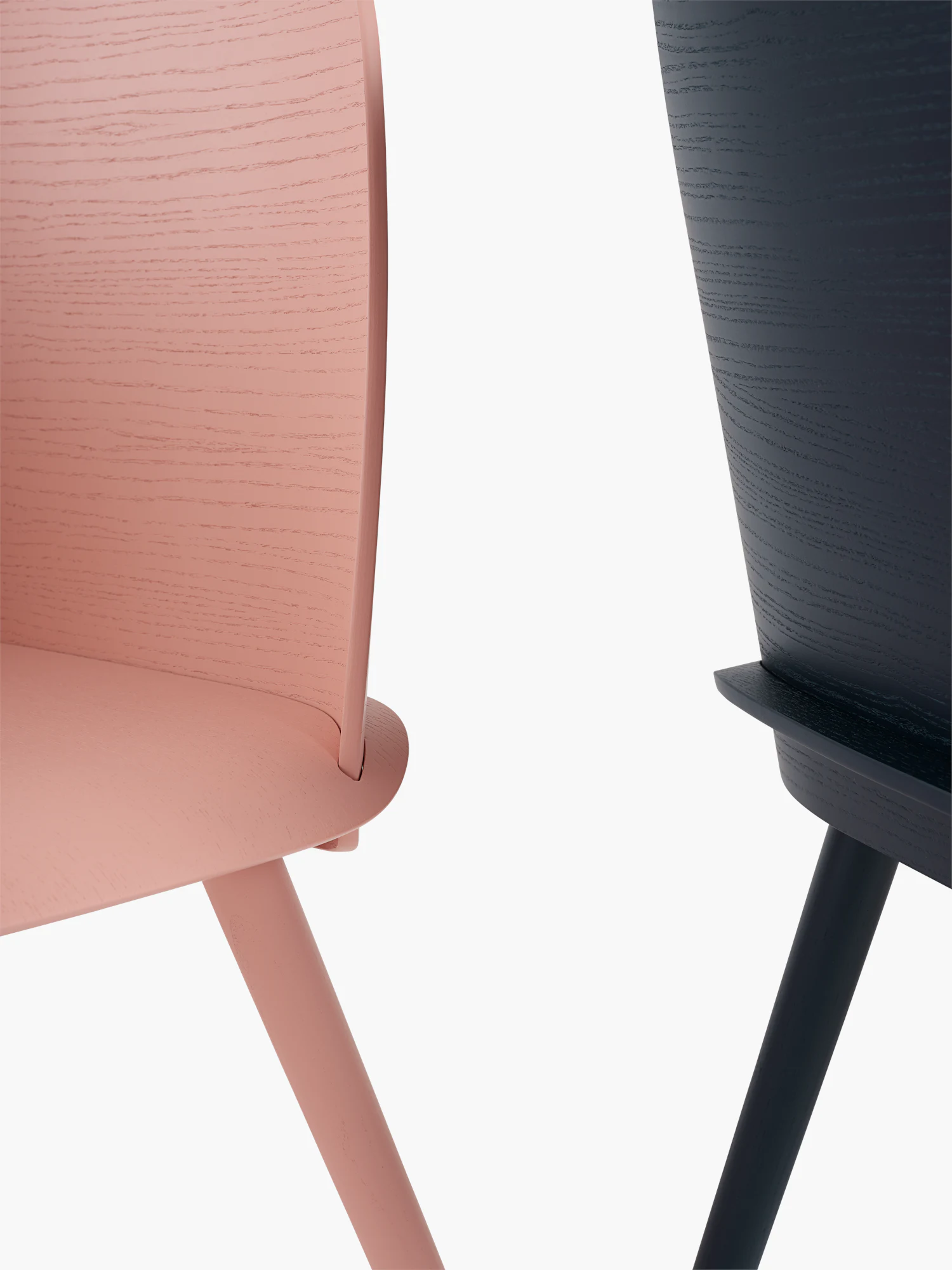 Close-up of Nerd Chair upholstery edge and tapered wooden legs.