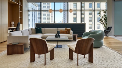 A Knoll Risom Lounge Chair, marble Krusin Coffee Table, Muuto Pouf, Outline Sofa, and Cosy Table Lamp at the Knoll San Francisco showroom