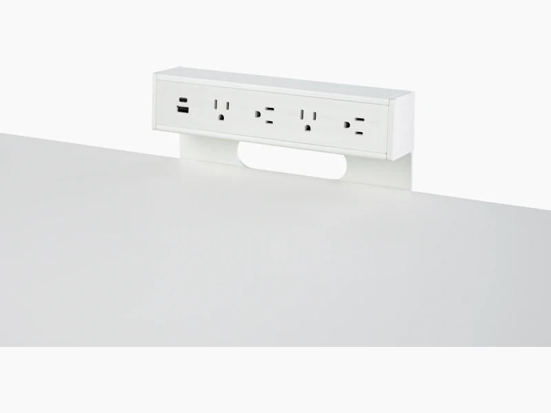 USB-A port, USB-C port, and four A/C power outlets on an attached table power source.