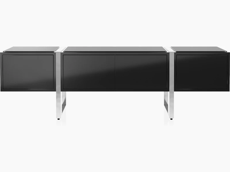 Highline Credenza in Black Polyester with Clear Black Backpainted Glass top and Polished Chrome legs viewed from the front.