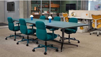 Several Asari Chairs by Herman Miller arranged around a large table at the Herman Miller Fulton Market showroom in Chicago