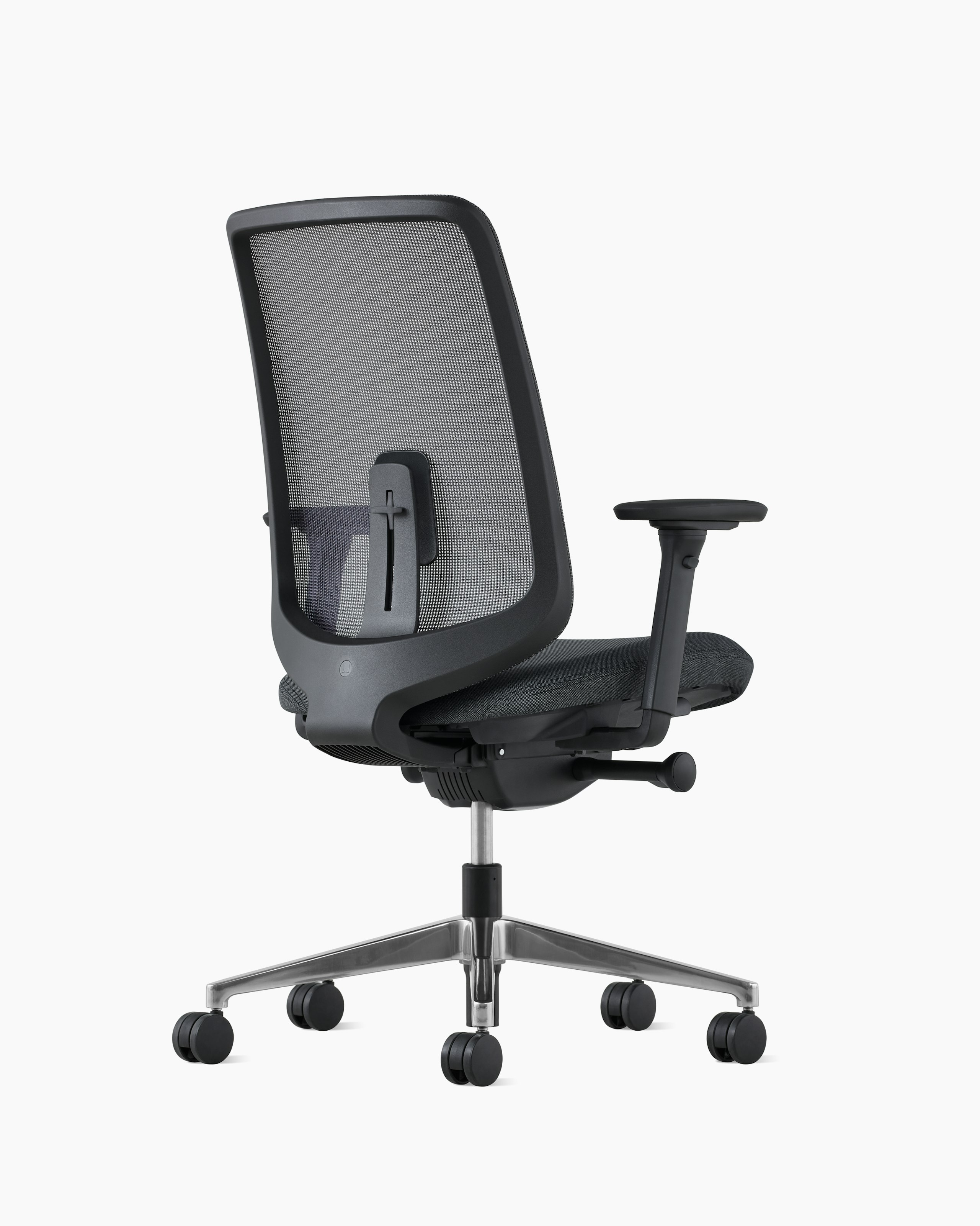 A black Verus Chair with adjustable lumbar support, viewed from the back at an angle.