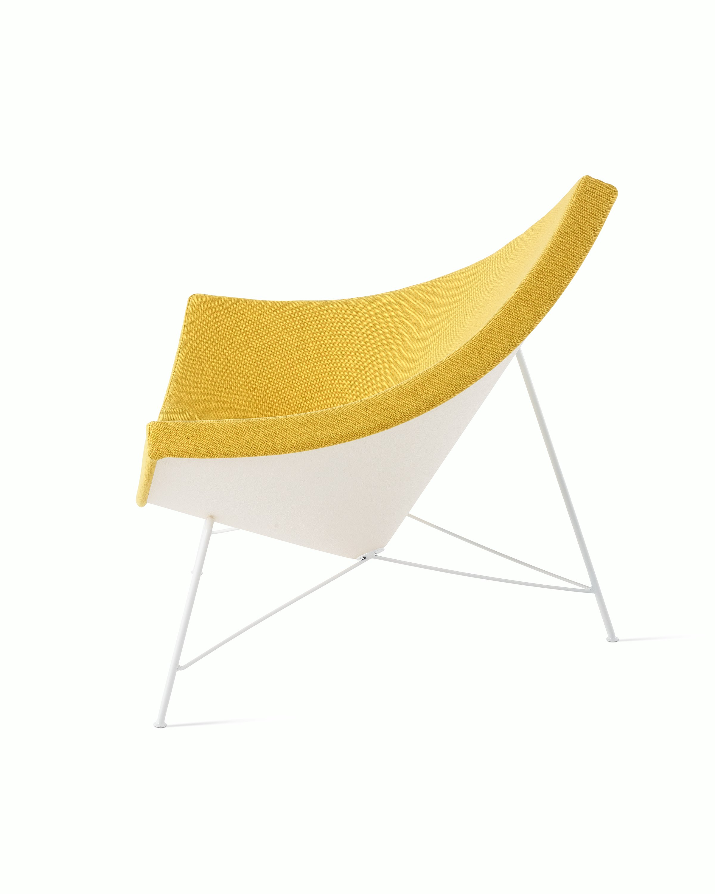 Profile view of  Nelson Coconut  Lounge Chair in a yellow Mode fabric.