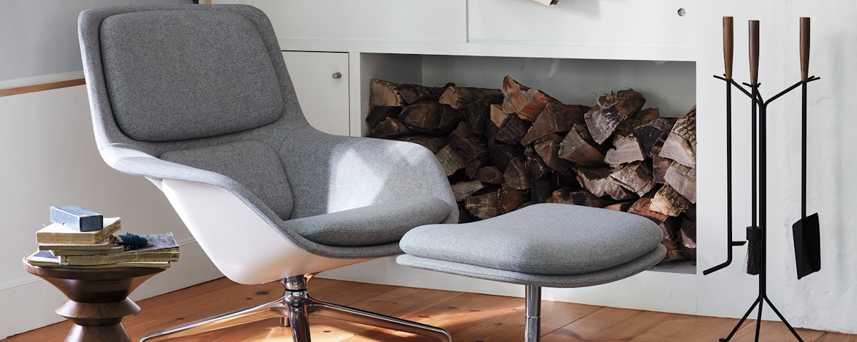 Striad Lounge Chair and Ottoman in a living room setting