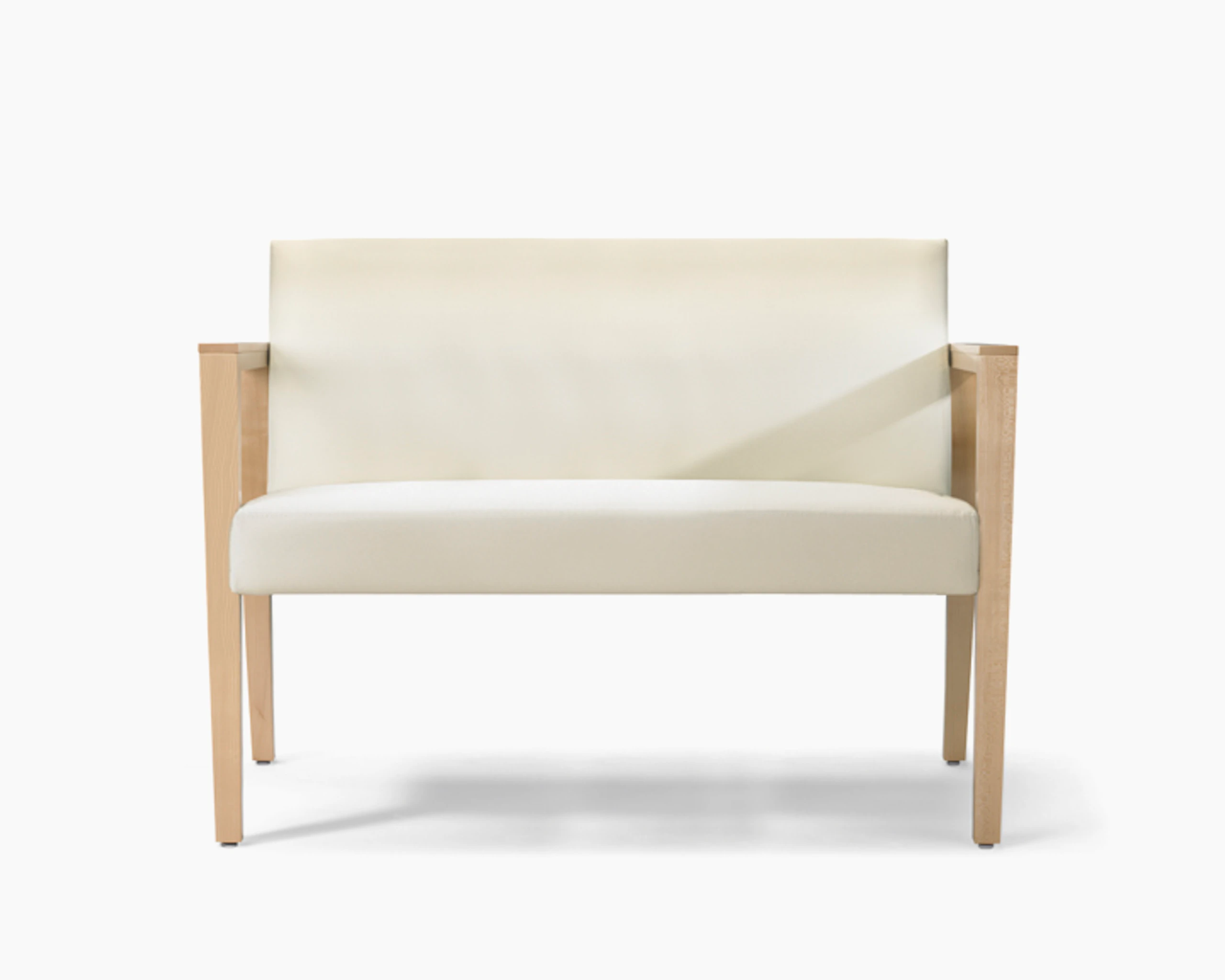 A front view of a Brava 863 plus chair in white textile with open maple wood arms.