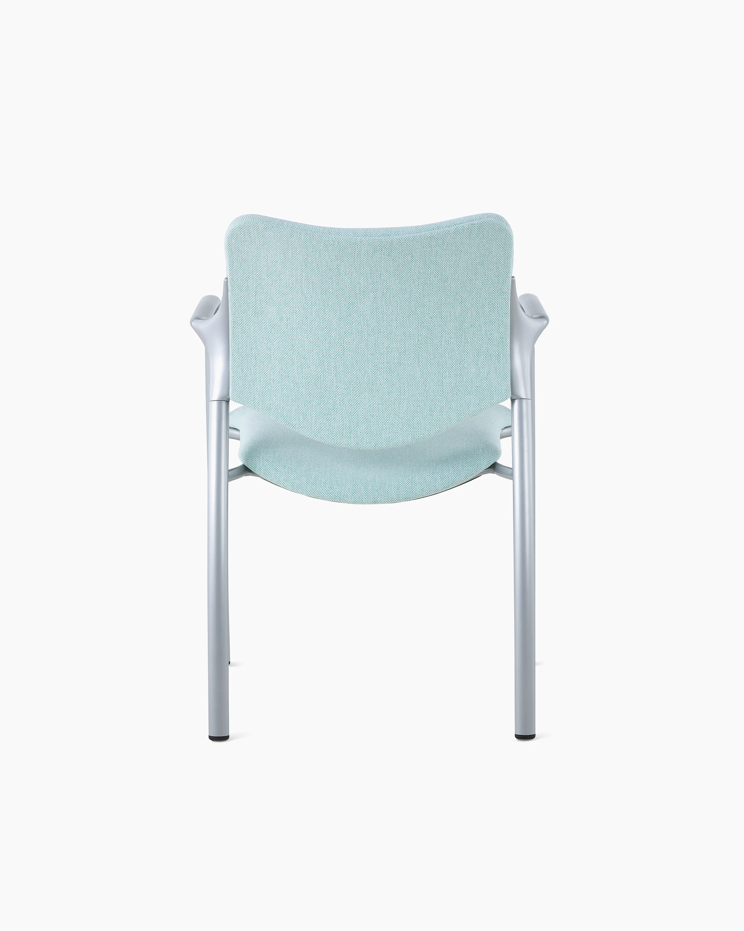 An Aside Chair with light green upholstered seat and back, viewed from the back.