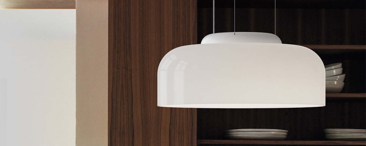 Totem Down Pendant in a kitchen setting with shelves of dishes in the background
